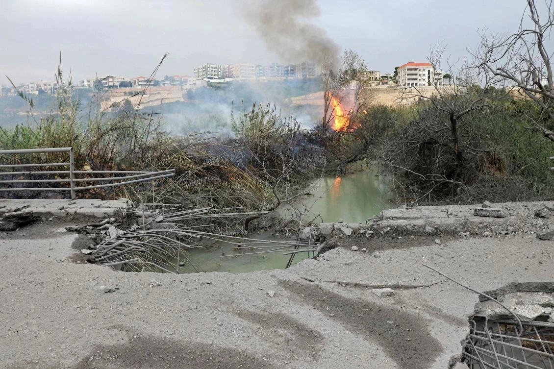 This photograph shows the destroyed Qasmiye Bridge built over the Litani River, following an Israeli airstrike, in Qasmiye on Mar. 18, 2026. (AFP)