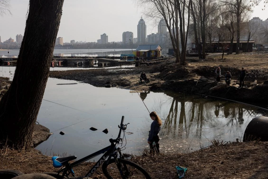Anglers cast their fishing rods into a pond in Kyiv’s Obolon neighbourhood on March 23, 2026, amid Russia’s ongoing invasion of Ukraine. (FILE/AFP)
