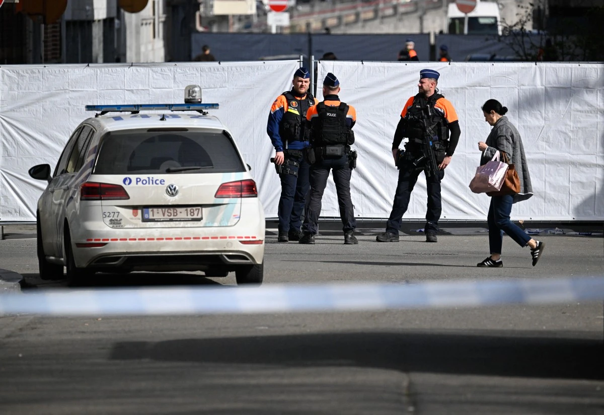 Belgian police man the perimeter established around a synagogue on Leon Fredericq street, after it was struck overnight by a blast in Liege on March 9, 2026. (AFP)