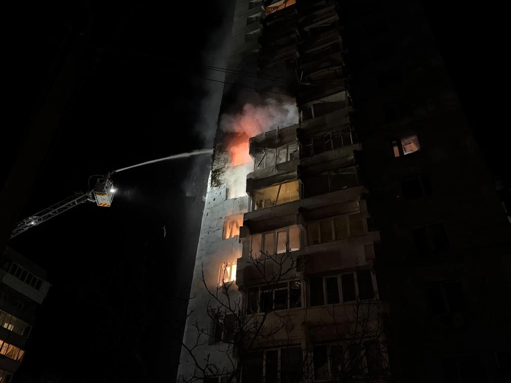 Firefighters extinguish a fire in an apartment building following a Russian air attack in Zaporizhzhia early on March 24, 2026, amid the Russian invasion of Ukraine. (AFP)