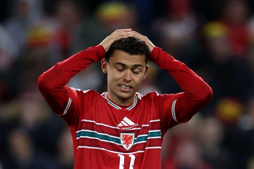 Wales’ midfielder Brennan Johnson reacts after failing to score a penalty. (AFP)