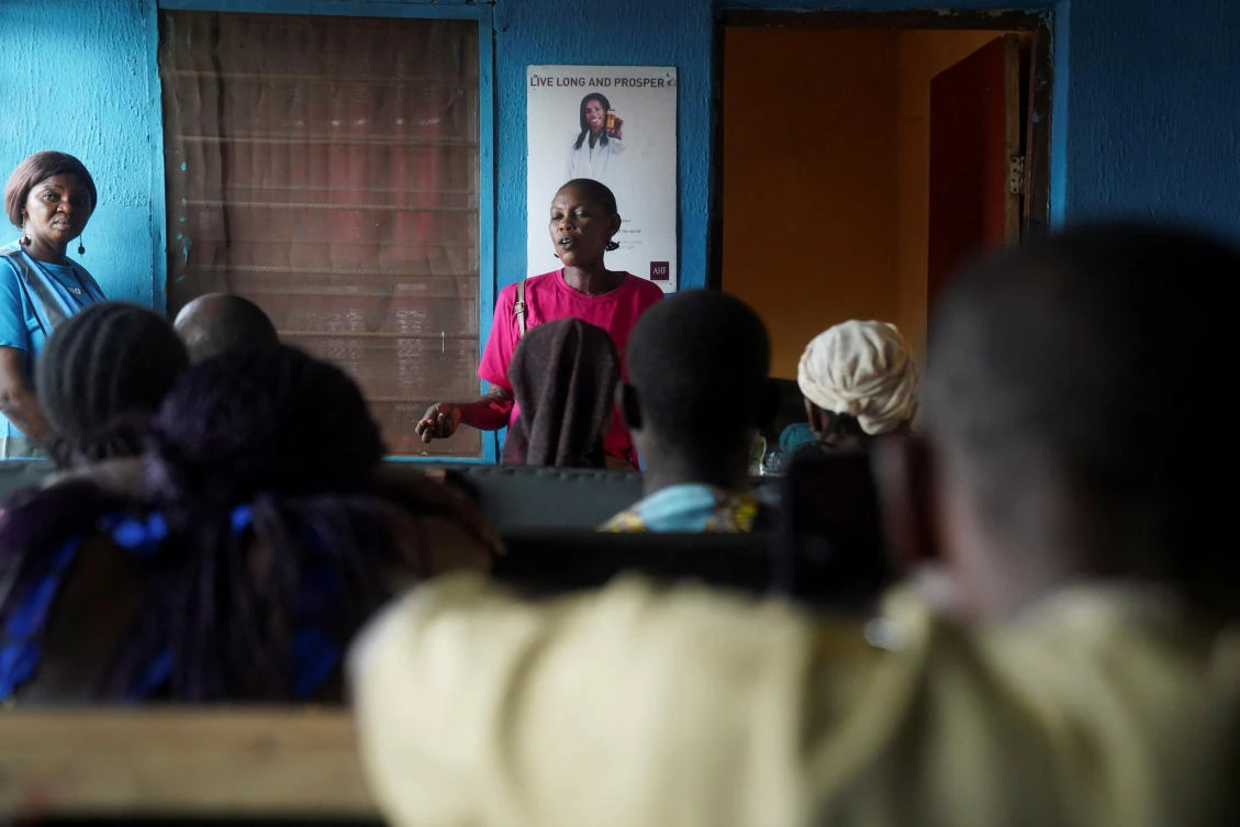 An HIV advocate with talks to patients at a family support clinic in Agan, Makurdi, Benue State, Nigeria on Feb. 12, 2026. (Reuters)