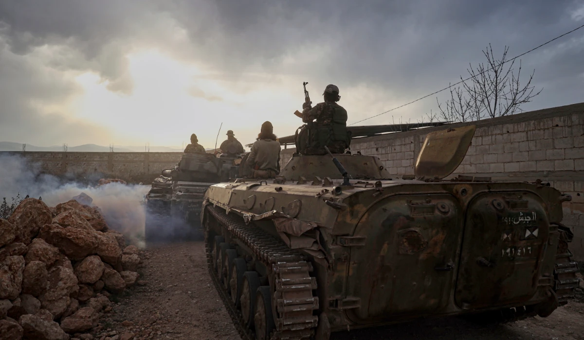 Syrian troops maneuver in the village of Hawsh al-Sayyid Ali, located 2 km (1.24 miles) from the Lebanon border, Syria, Monday, March 17, 2025. (AP)