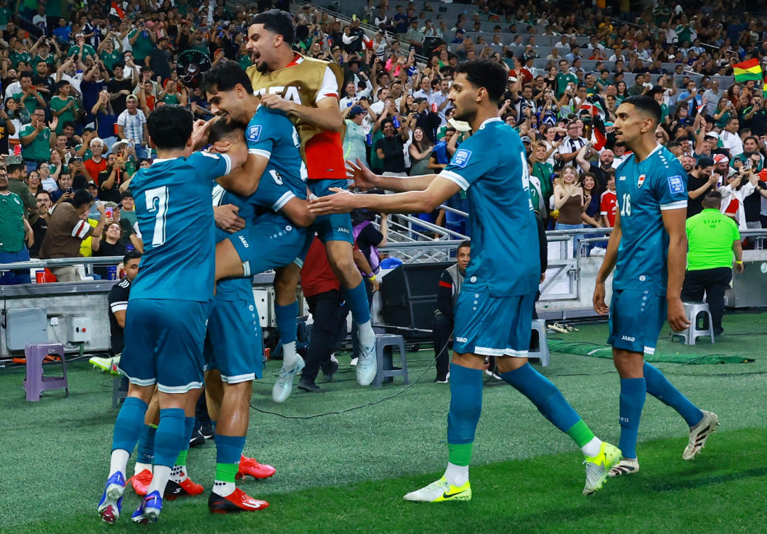 Soccer Football - FIFA World Cup - Inter-Confederation Playoffs - Final - Iraq v Bolivia - Estadio Monterrey, Monterrey, Mexico - March 31, 2026 Iraq's Ali Al-Hamadi celebrates scoring their first goal with teammates REUTERS/Raquel Cunha