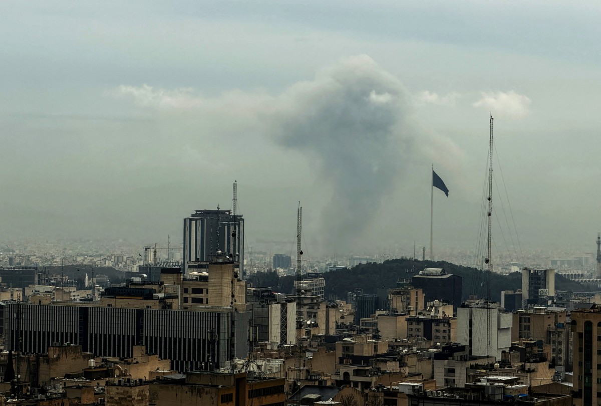 Plumes of smoke rise from the site of a strike in Tehran on March 16, 2026. (AFP)