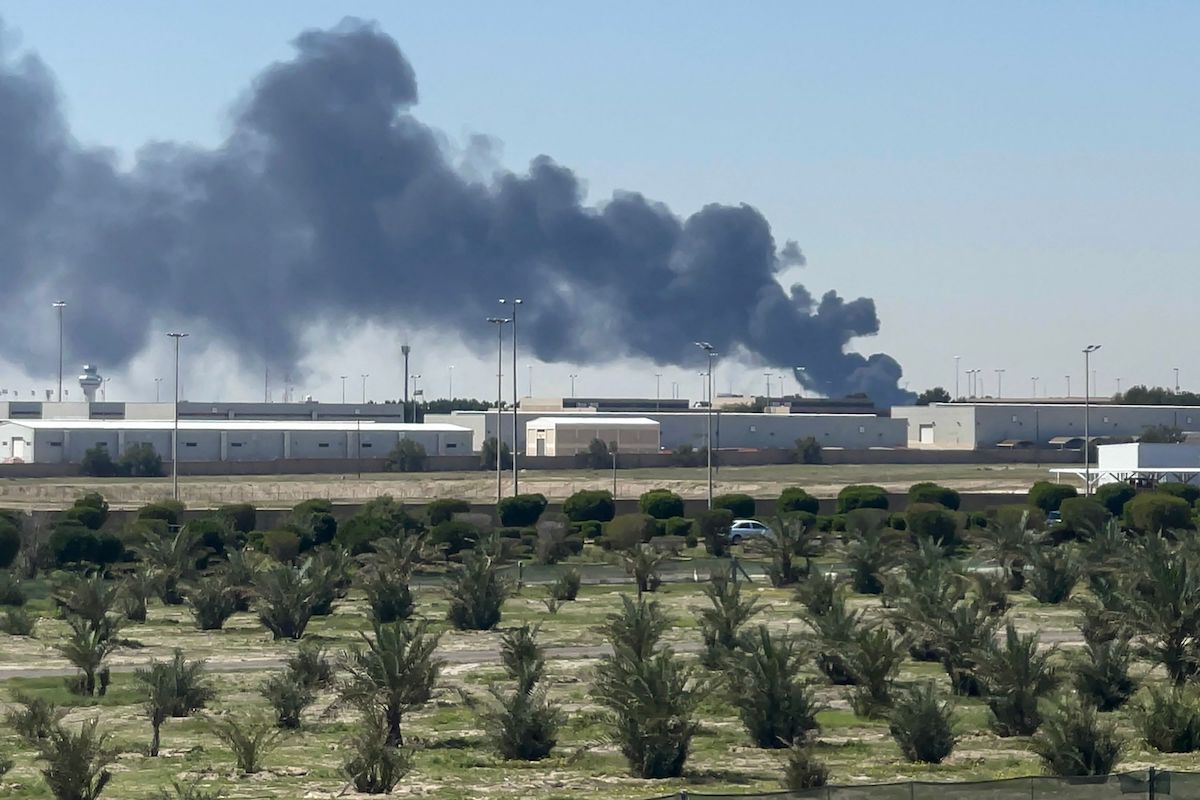 Smoke rises from Kuwait's international airport after a drone strike on Wednesday. (AFP)