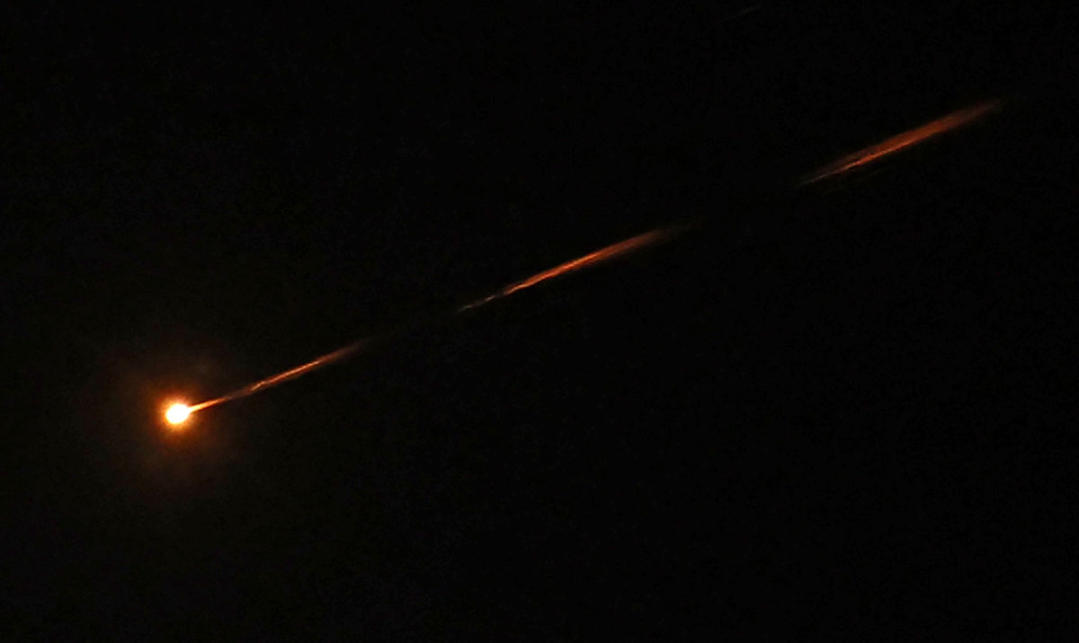 An Iranian missile streaks across the sky over Jerusalem. (AFP)