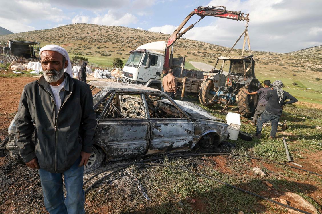 Palestinians inspect a burned vehicle and tractor following an Israeli settlers attack in the northen outskirts of Tayasir village near the occupied West Bank town of Tubas on March 31, 2026. (Photo by JAAFAR ASHTIYEH / AFP)