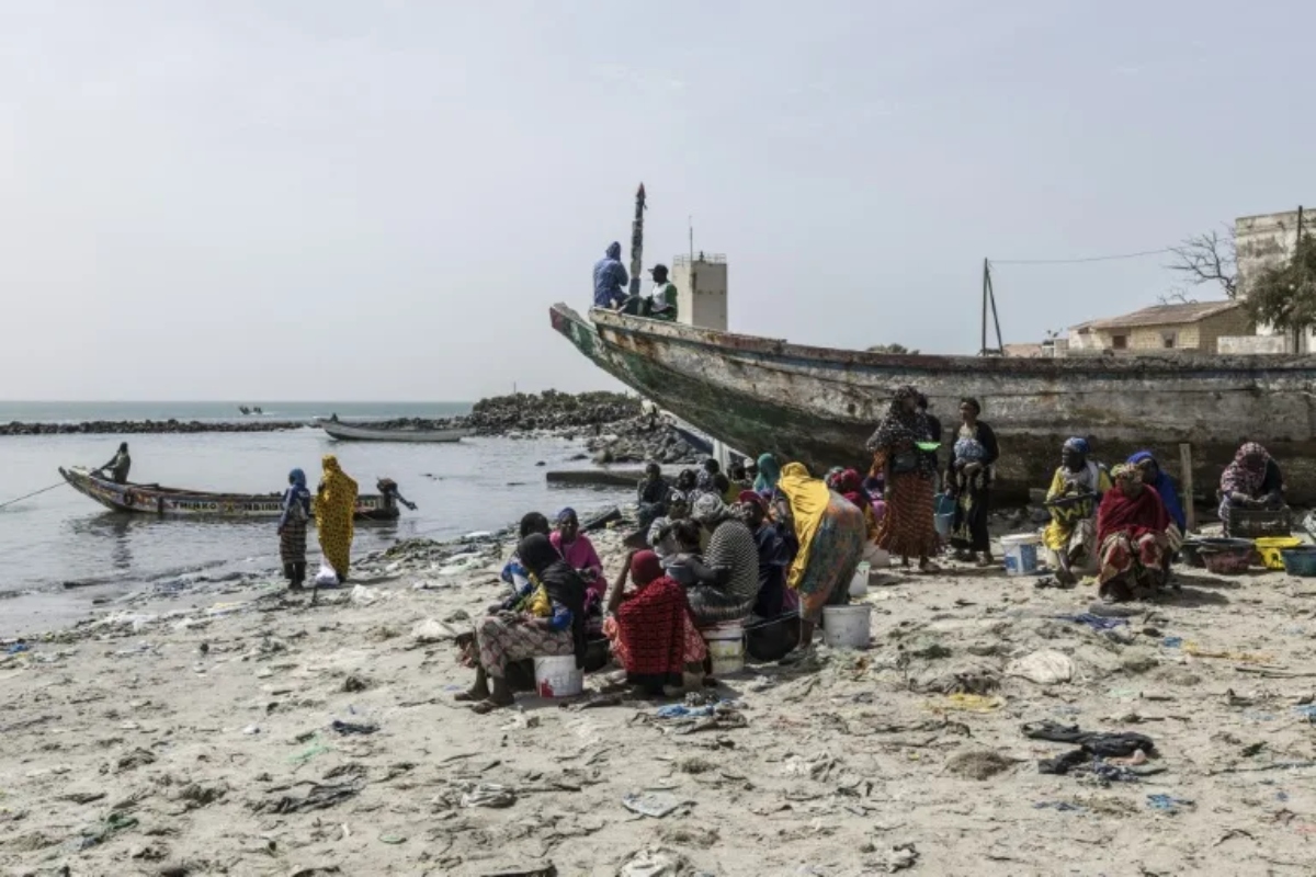 Ibrahima Mar first lost his livelihood then lost his son when the fish off Senegal's coast began to disappear, rupturing a way of life that had sustained his family for generations. (AFP)