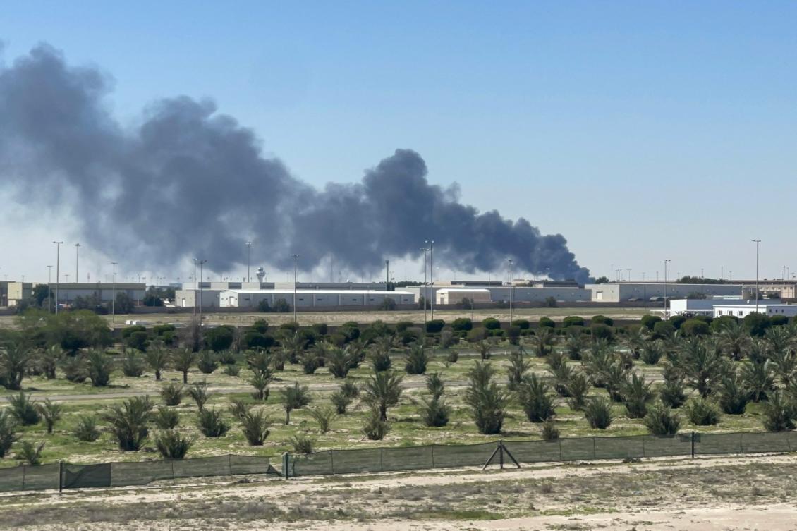 Above, smoke rises from an area of Kuwait’s international airport after an Iranian strike on April 1, 2026. Kuwait has been bearing the brunt of Iranian missile and drones attacks since the war erupted on February 28. (AFP file photo)