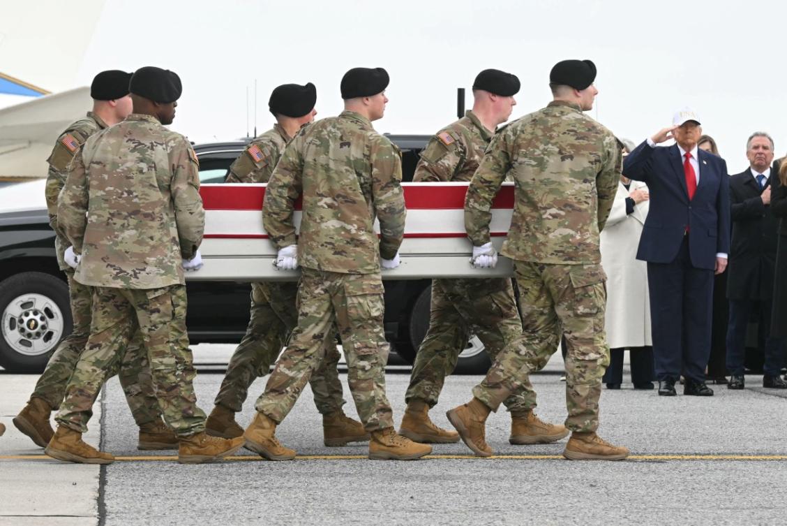 US President Donald Trump salutes as the remains of Sgt. 1st Class Noah L. Tietjens is carried during dignified transfer solemn event at Dover Air Force Base, in Dover, Delaware, on March 7, 2026. (AFP)