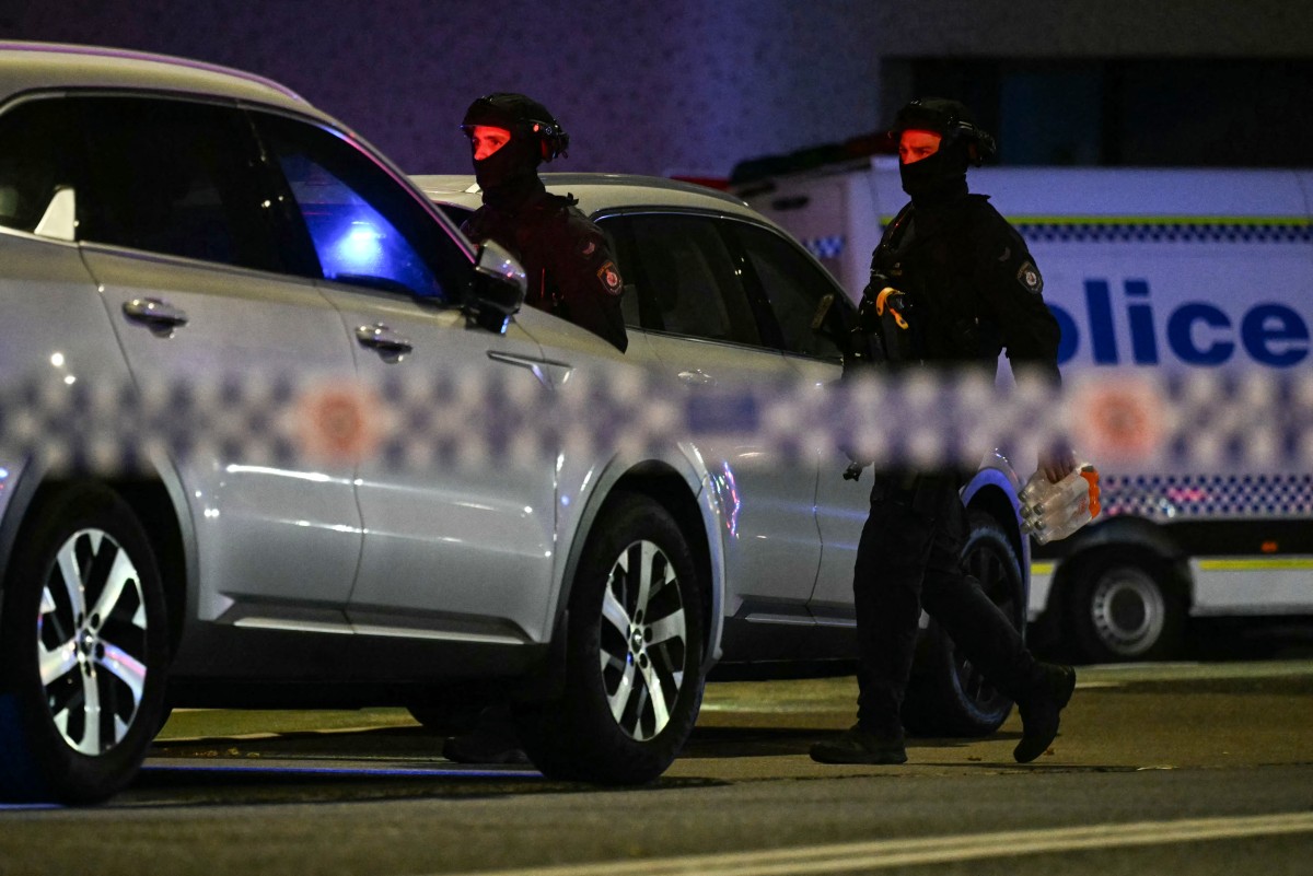 Police work at the scene after a shooting incident at Bondi Beach in Sydney on December 14, 2025. (AFP)