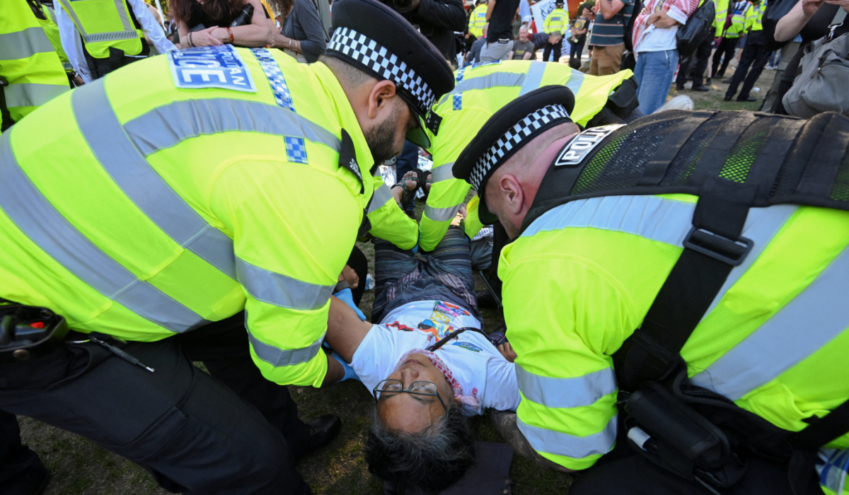 Police officers detain a protester during a rally organised by Defend Our Juries, challenging the British government's proscription of "Palestine Action" under anti-terrorism laws, in Parliament Square, in London, Britain, August 9, 2025. (REUTERS)