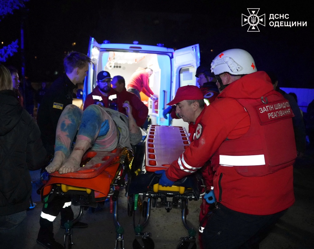 Medical workers evacuate a resident from the apartment building hit by a Russian drone strike, in Odesa, Ukraine. (Handout)