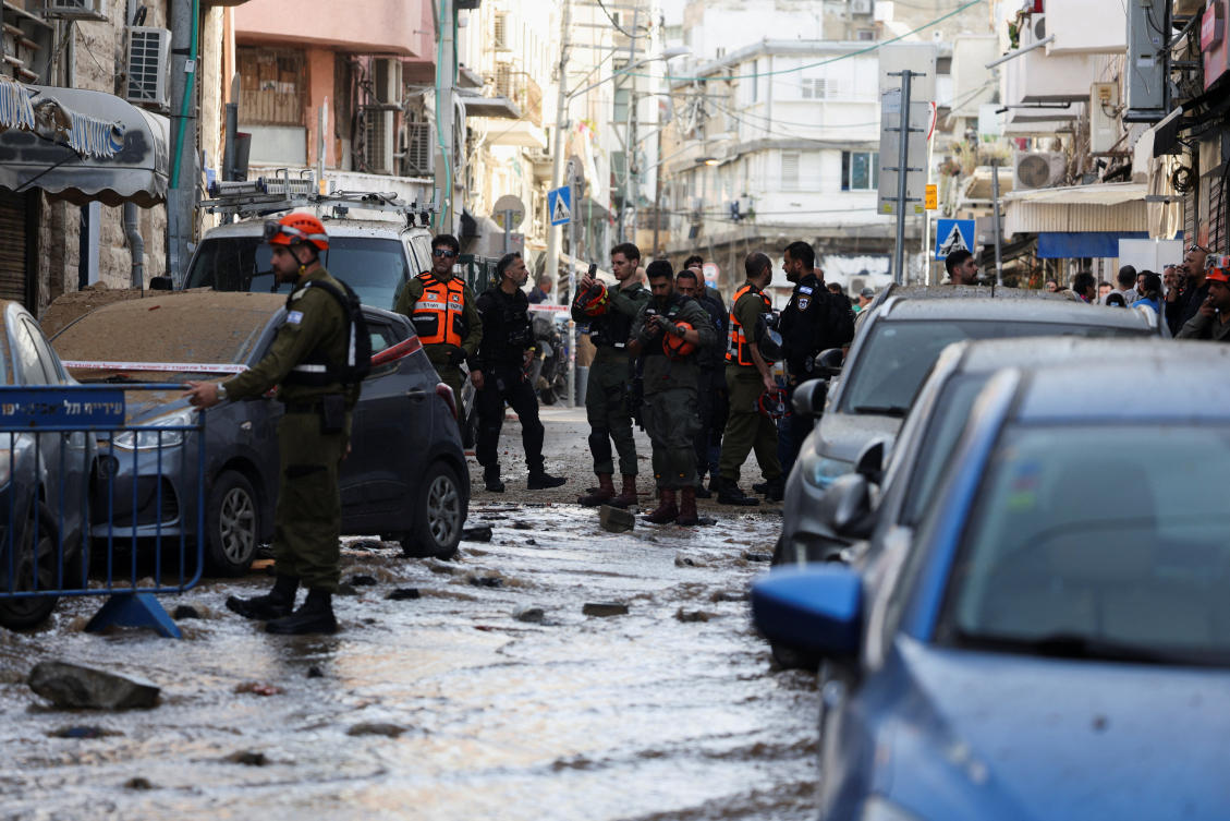 Emergency personnel work near a damaged building at an impact site, following an earlier barrage of missiles launched from Iran, in Tel Aviv, Israel on April 6, 2026. (Reuters)
