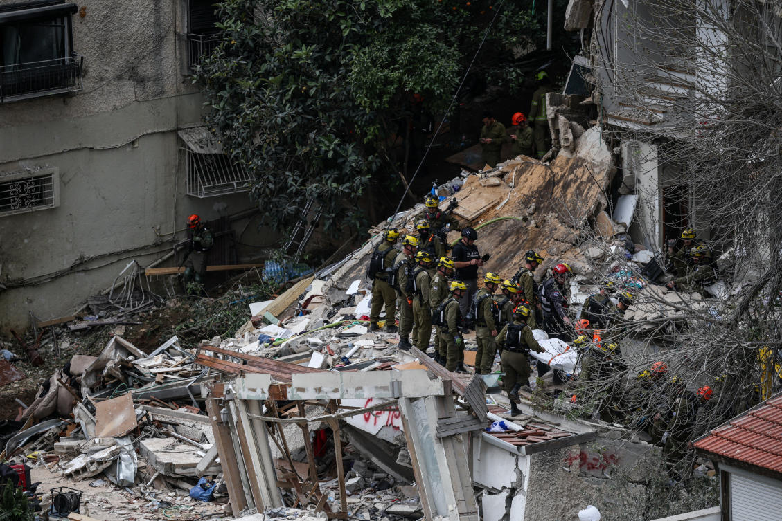 Emergency personnel work at the site of a projectile impact in Haifa, Israel on April 6, 2026. (Reuters)