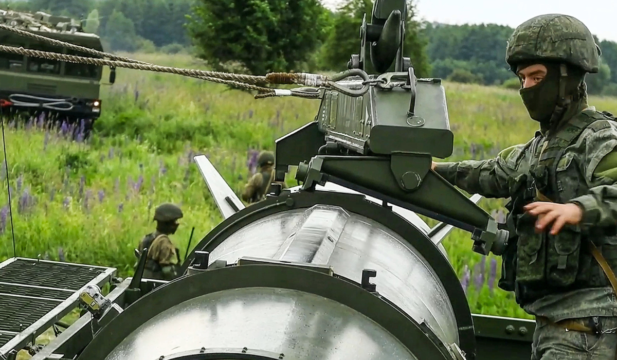 Russian soldiers load a Iskander-M short-range ballistic missile launchers at a firing position as part of Russian military drill intended to train the troops in using tactical nuclear weapons. (AP file photo)