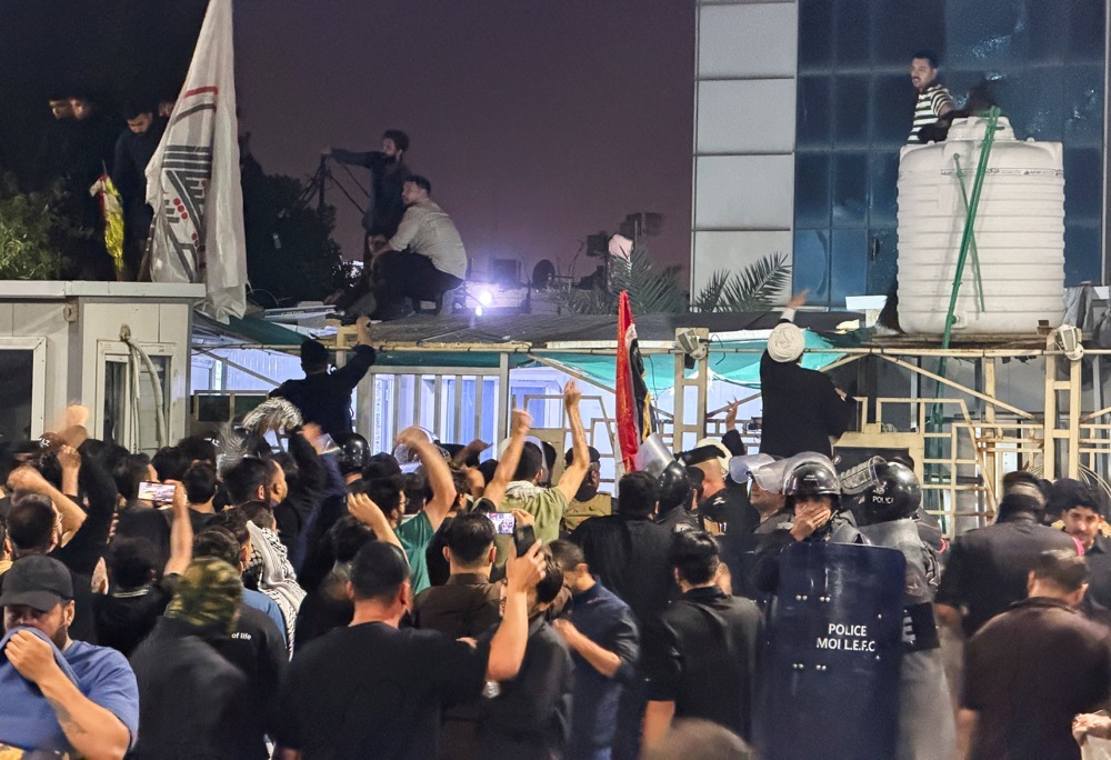 Protesters gather outside the Kuwaiti consulate after rockets fired from the direction of Kuwait hit a house in Khor Al-Zubair, Basra, Iraq. (Reuters)