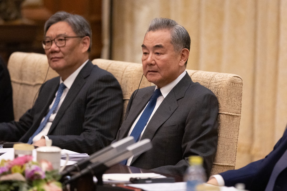 Foreign Minister Wang Yi participates in a meeting with German Chancellor Friedrich Merz at the Diaoyutai State Guesthouse in Beijing, China. (AFP)