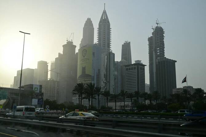 Residents in Dubai, as well as other UAE cities, have got used to the sound of air defenses intercepting Iranian drones and missiles during the conflict. (AFP/File)