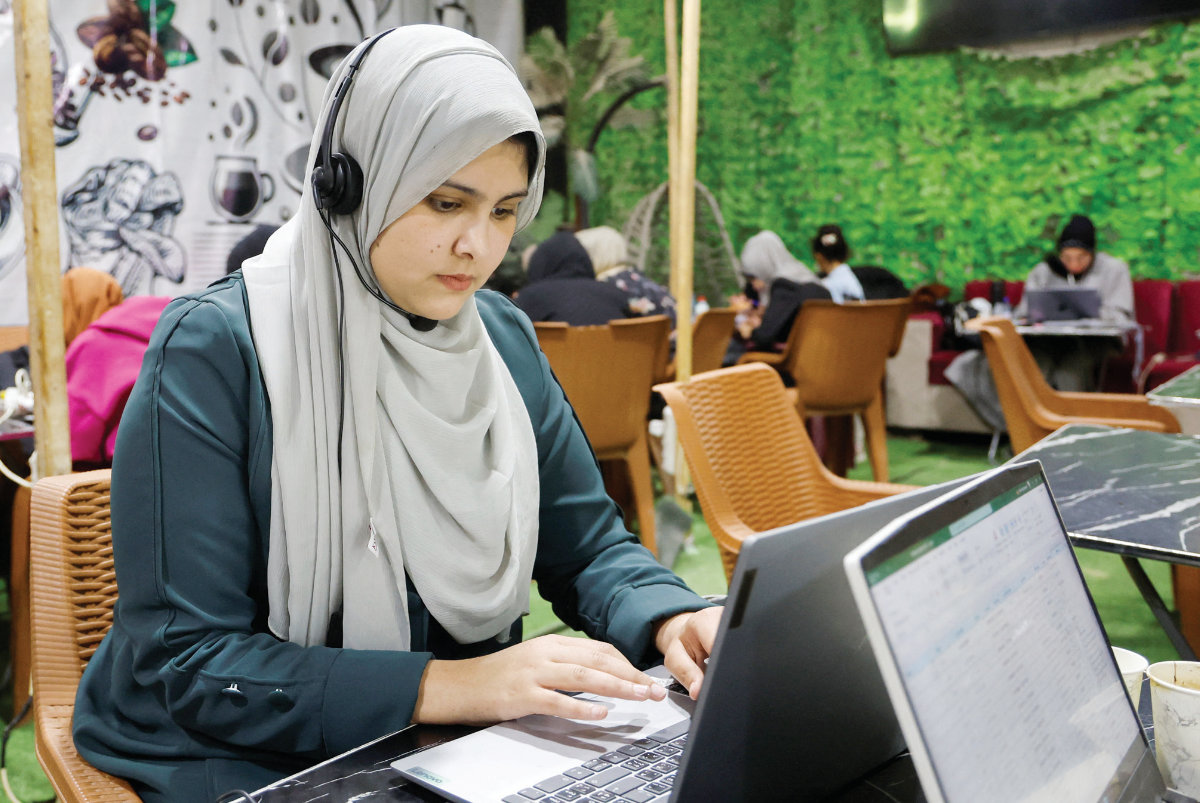 Palestinian female students study inside a cafe in Khan Younis, southern Gaza Strip, amid the threat of Israeli bombardment. (Reuters)