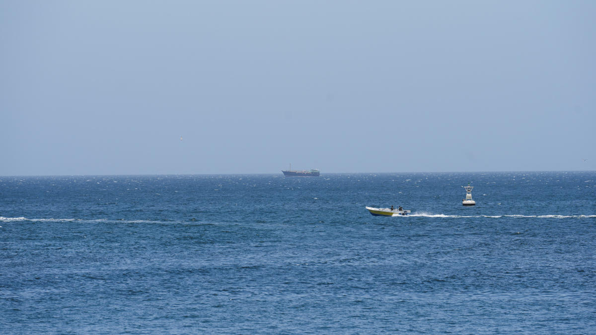 Above, vessels and boats off the coast of Musandam governorate, overlooking the strait of Hormuz, in Oman on April 8, 2026. (Reuters)