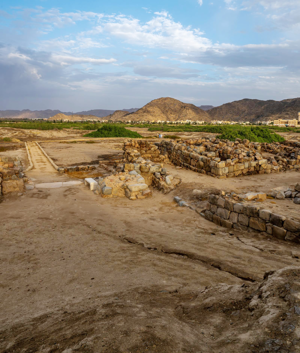 The site features a central city enclosed by a wall measuring 235 meters long and 220 meters wide, with building foundations of hewn stone blocks and upper sections of mud brick. (SPA)