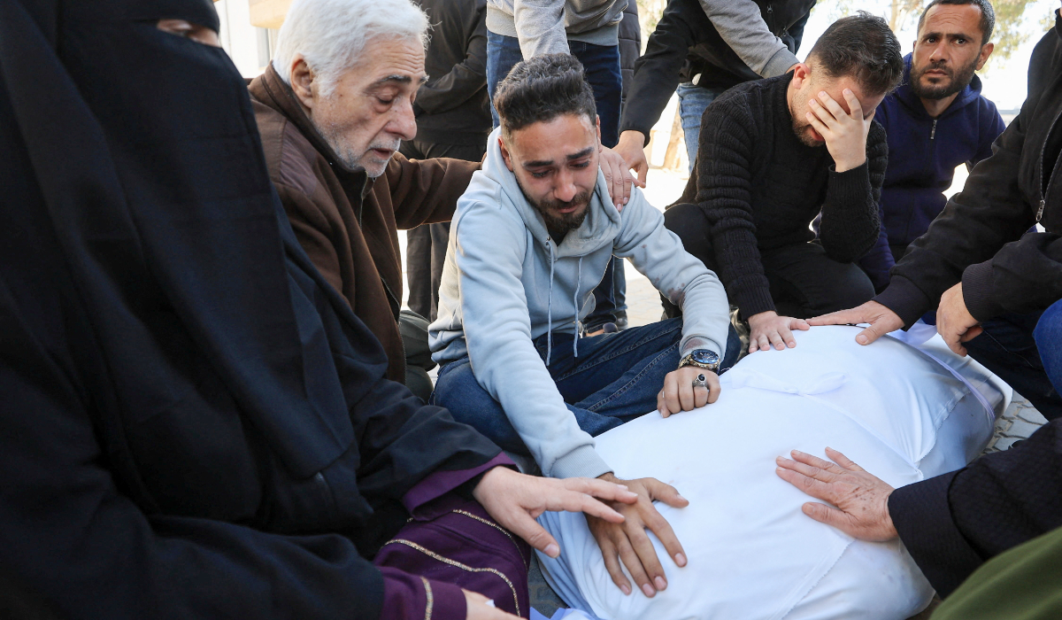 Mourners react during the funeral of two Palestinians, who were killed on Thursday in an Israeli strike, according to medics, at Al-Shifa Hospital in Gaza City, April 10, 2026. (REUTERS)