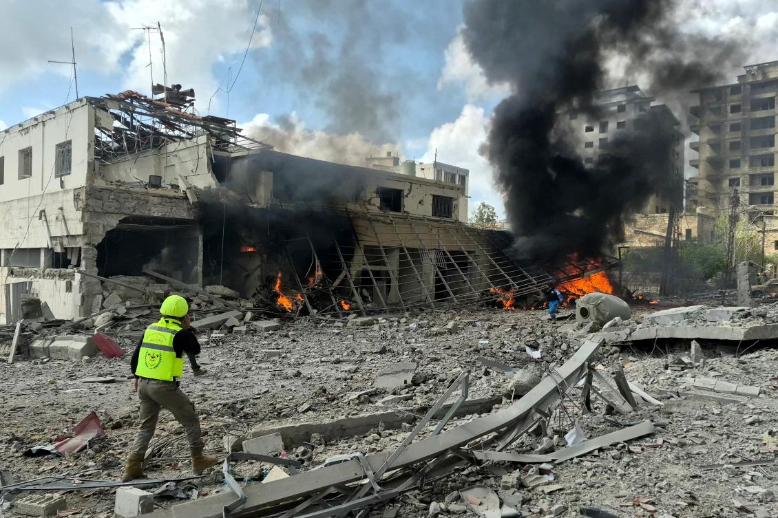 First responders rush to the site of an Israeli airstrike that targeted the Lebanese State Security Center, in the Southern Lebanese city of Nabatieh on April, 10 2026. (AFP)