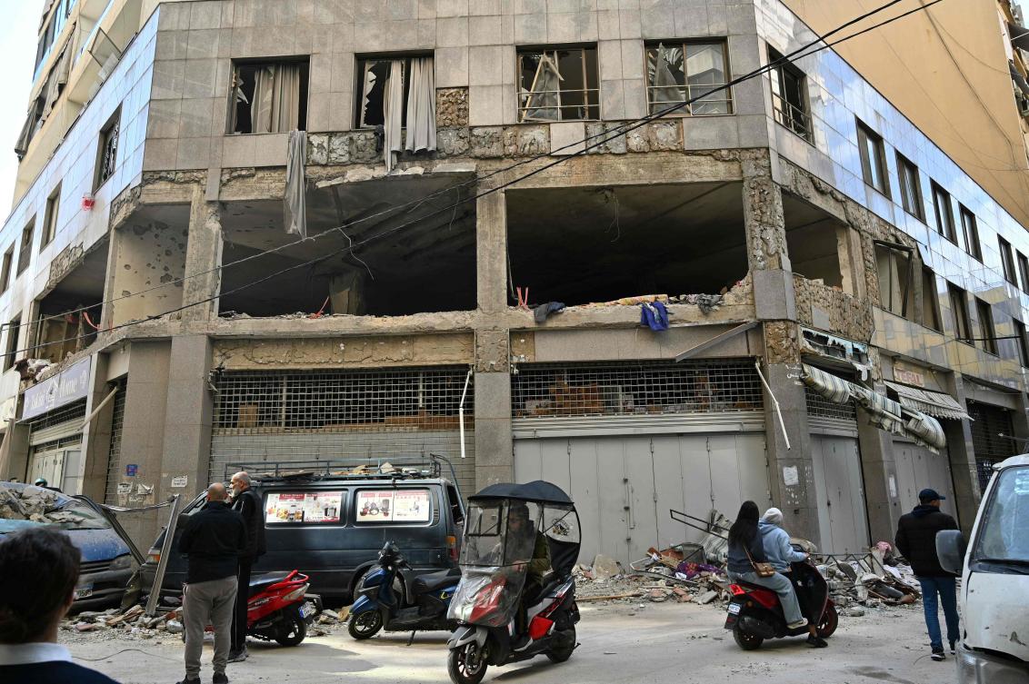 People inspect the site of an Israeli airstrike the day after striking the Basta neighborhood of Beirut on April 9, 2026. (AFP)
