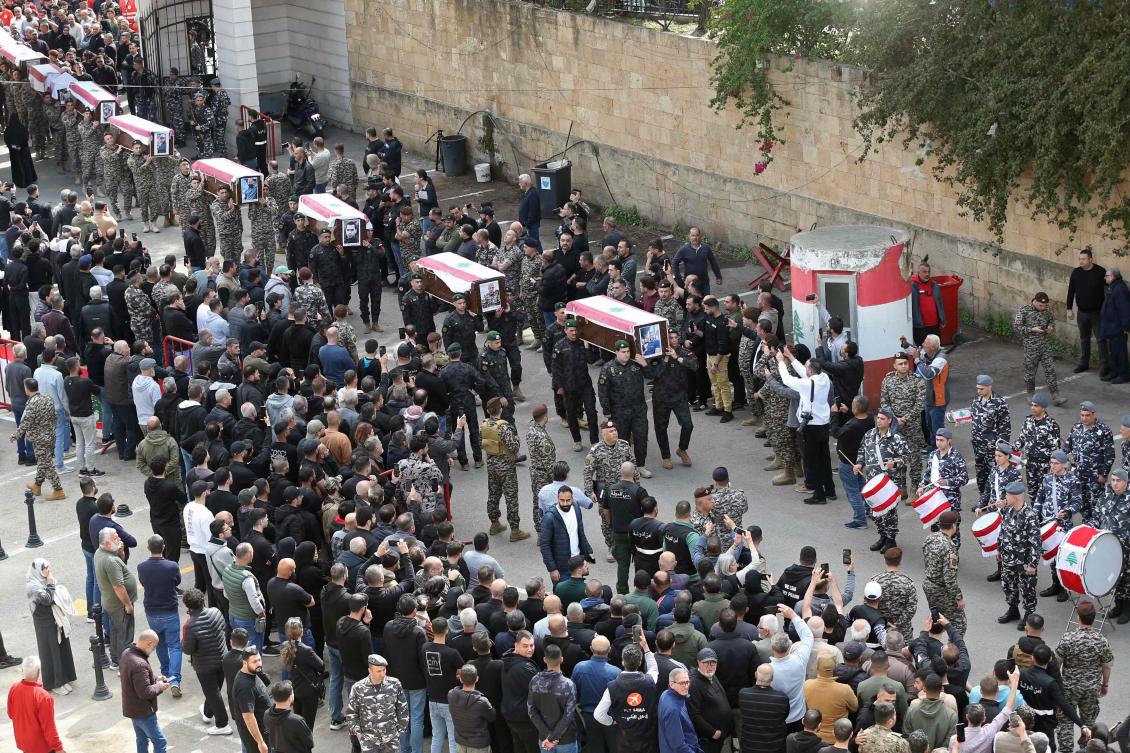 Mourners carry the coffins of the members of Lebanon’s State Security agency, who were killed by an Israeli strike, during their funeral procession in Sidon on Apr. 11, 2026. (AFP)