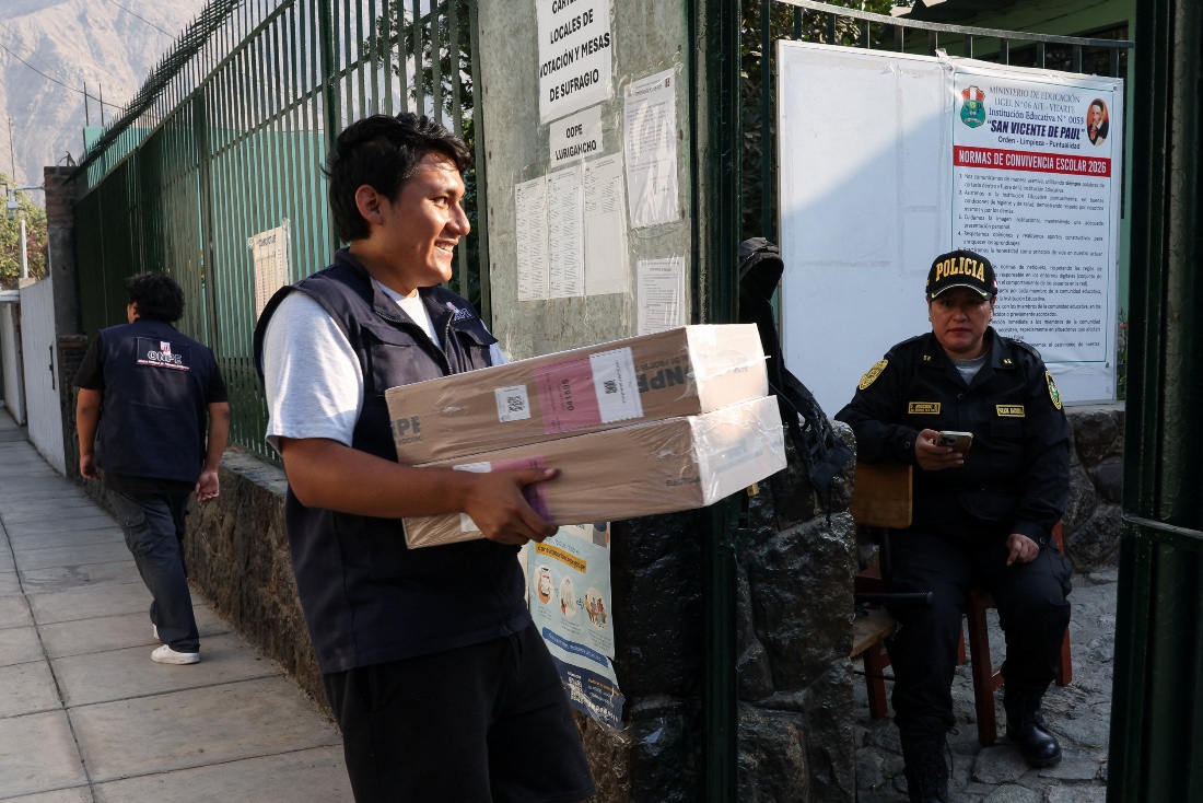 A Peruvian electoral worker distributes voting materials to polling stations ahead of the April 12 general election, in Lima, Peru. (Reuters)