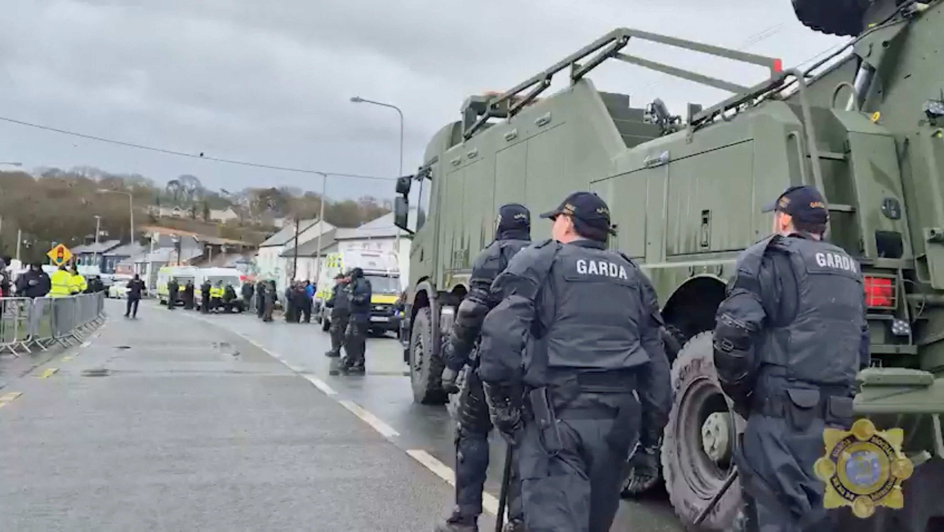 The intruder dressed in black appeared to be striking the fuselage with an object. (REUTERS)