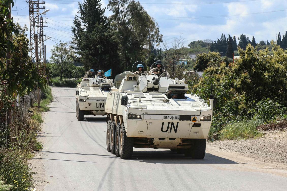 Members of the UN peacekeeping force in Lebanon (UNIFIL), in armored vehicles, patrol the road of the southern Lebanese village of Tair Debba on April 12, 2026. (AFP)