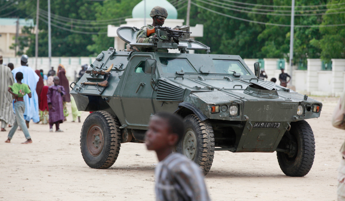 Nigerian soldiers ride on an armored personnel carrier in Maiduguri, in Borno state, Nigeria, Aug. 8, 2013. (AP)