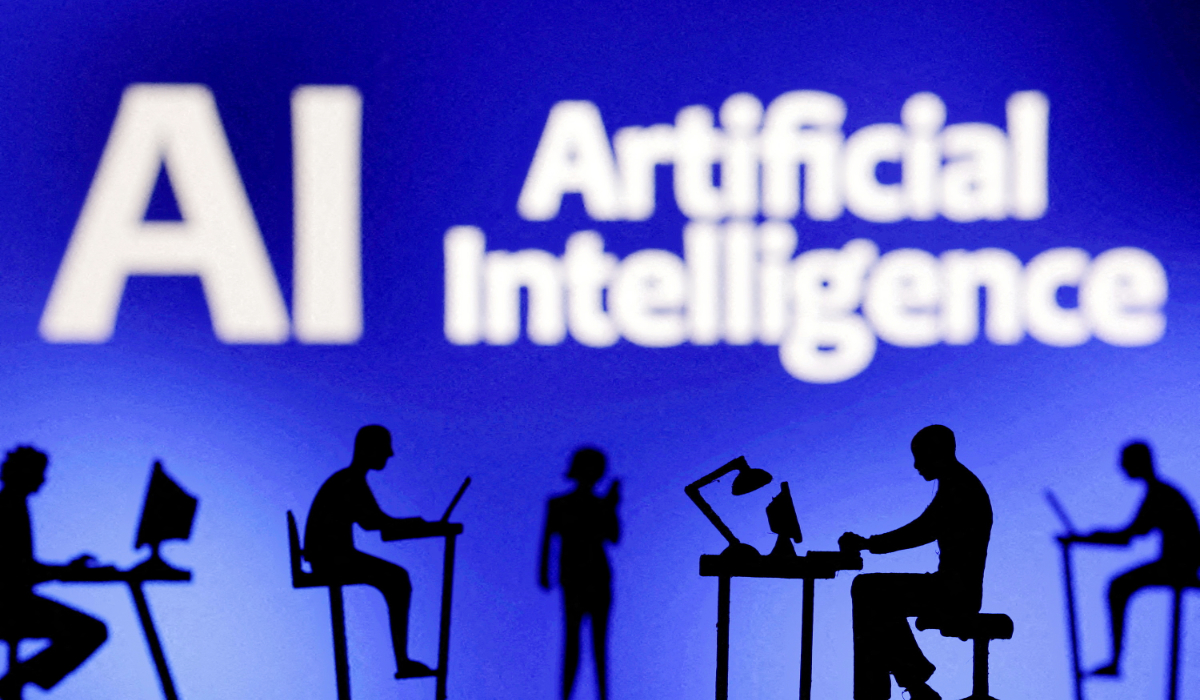Figurines with computers and smartphones are seen in front of the words "Artificial Intelligence AI" in this illustration created on February 19, 2024. (REUTERS)