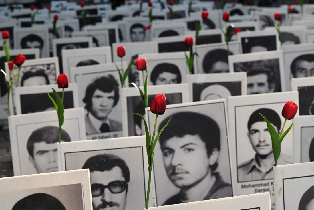 This photograph shows portrait placards of people executed by the government of Islamic Republic of Iran, displayed during a demonstration by Franco-Iranian associations in Paris, France. (AFP)