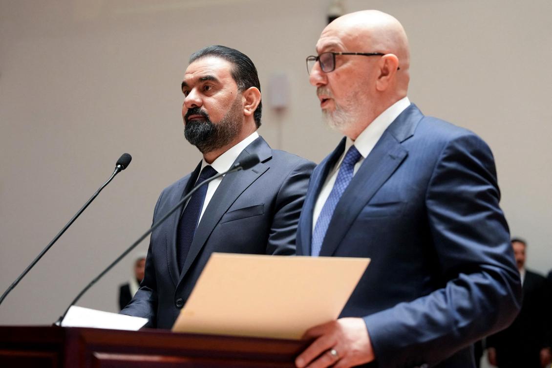 Iraq’s newly elected President, 58-year-old former environment minister Nizar Amedi (R) speaking as Iraq's Speaker of the Iraqi Parliament Haibat al-Halbousi' listens on following his election as the new president. (FILE)