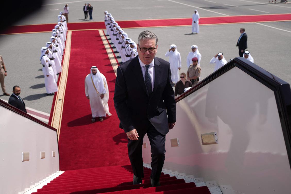 Britain's Prime Minister Keir Starmer boards his plane on Friday during a tour offering support to Gulf countries. Starmer said the UK would not be part of Trump's blockade of Iran. (AFP)