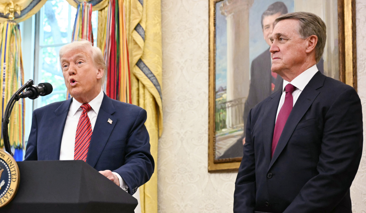 US President Donald Trump participates in a swearing-in ceremony for the Ambassador to China, former Republican Senator of Georgia, David Perdue in the Oval Office at the White House in Washington, DC, May 7, 2025. (AFP)