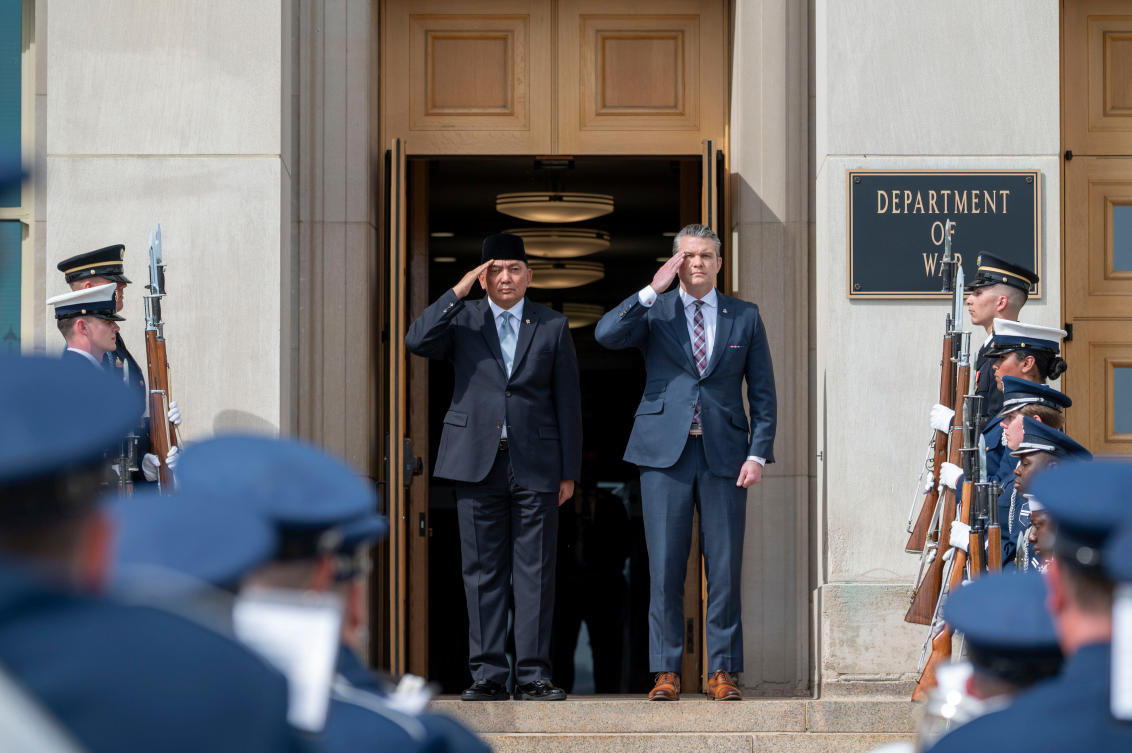 Defense Secretary Pete Hegseth and Minister of Defense for Indonesia Sjafrie Sjamsoeddin, left, salute during a welcoming ceremony at the Pentagon, Monday, April 13, 2026 in Washington. (AP Photo/Kevin Wolf)