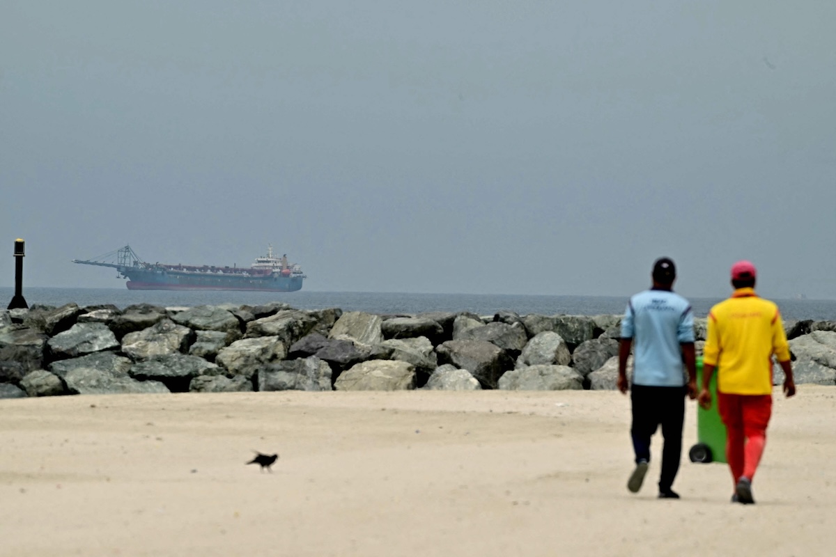 Above, a ship is seen in the Arabian Gulf off the coast of Sharjah on April 13, 2026. The US military started a naval blockade of the Strait of Hormuz on Monday night. (AFP)