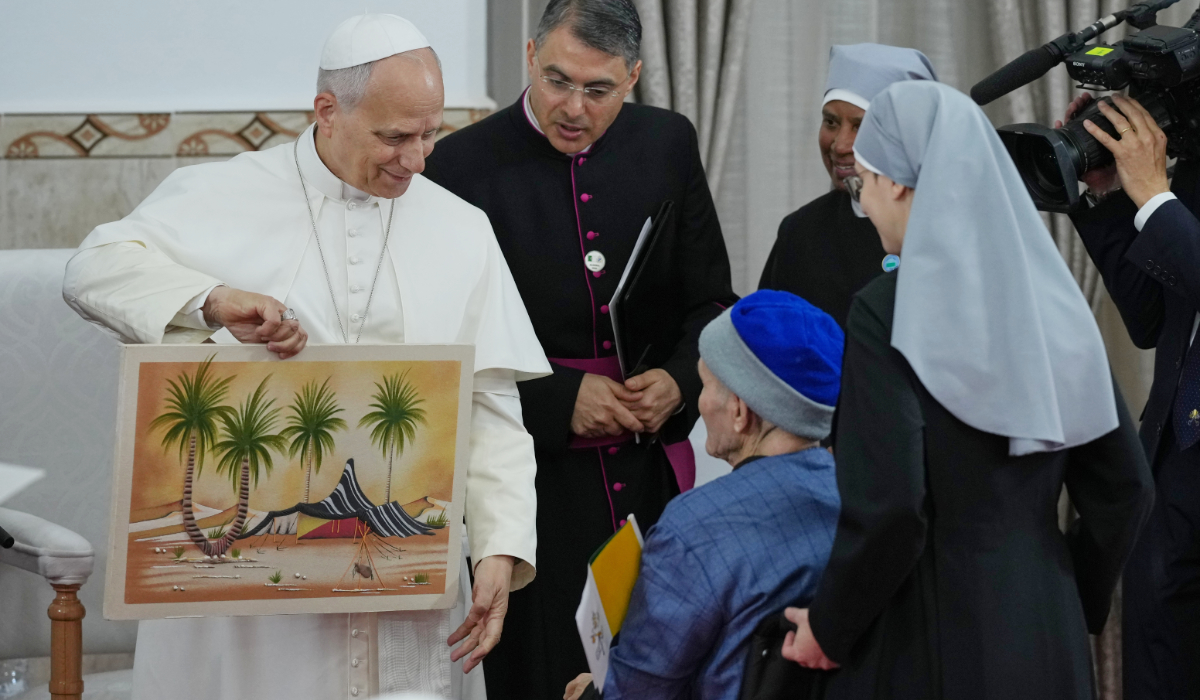 Pope Leo XIV is presented with a gift during his visit to the nursing home of the Little Sisters of the Poor in Annaba, Algeria, Tuesday, April 14, 2026, on the second day of an 11-day apostolic journey to Africa. (AP)