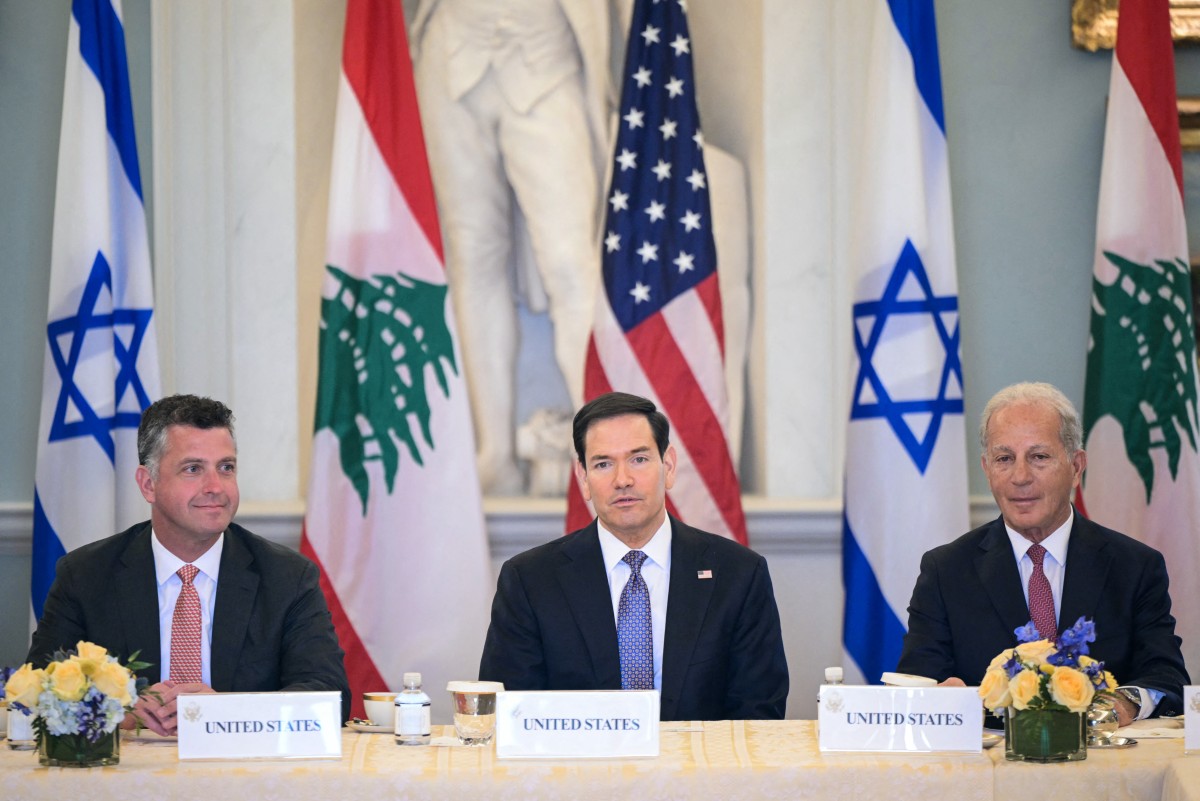 US Secretary of State Marco Rubio (C), alongside US State Department Counselor Michael Needham (L) and US Ambassador to Lebanon Michel Issa (R), speaks during a meeting with Lebanon’s Ambassador to the US Nada Hamadeh Moawad (out of frame) and Israeli Ambassador to the US Yechiel Leiter (out of frame) at the State Department in Washington, DC, April 14, 2026. (AFP)