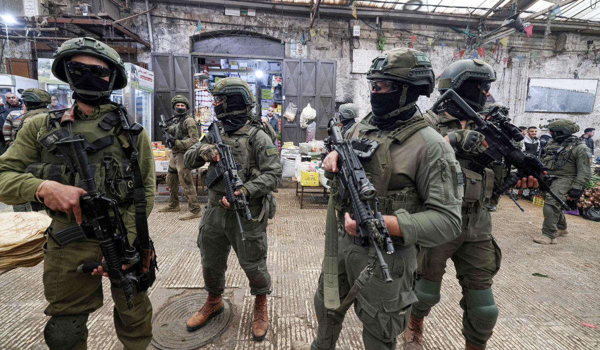 Israeli soldiers patrol the market in the Old City of Nablus, in the northern Israeli-occupied West Bank on April 12, 2026. (AFP)