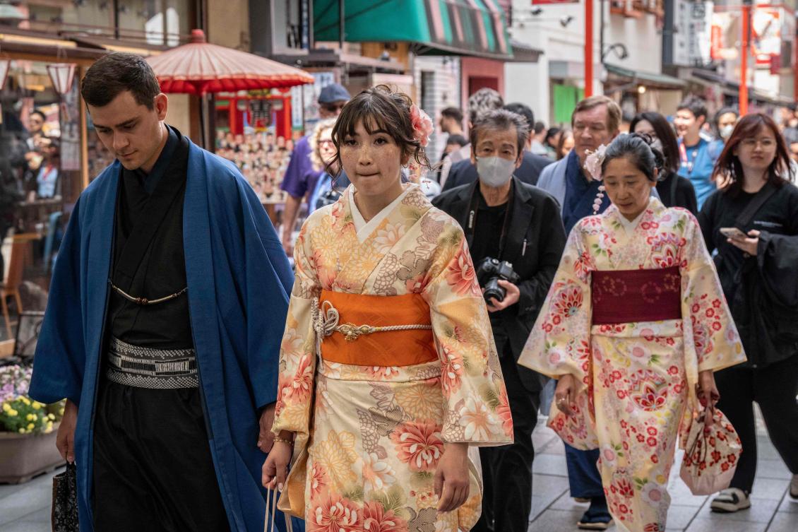 Foreign tourists wearing kimonos walk through Asakusa area of Tokyo on April 15, 2026. (File/AFP)