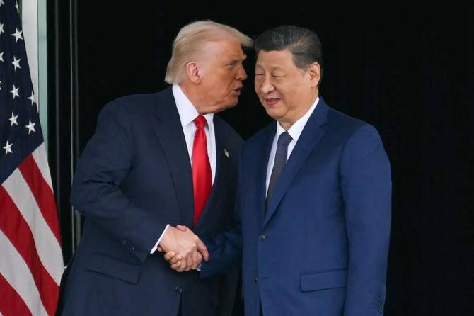 President Trump and China's leader Xi attending talks in South Korea last year. Trump says China agreed not to send weapons to Iran. (File/AFP)
