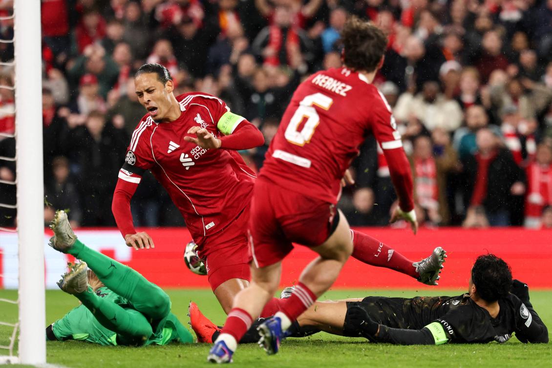 Liverpool’s Dutch defender Virgil van Dijk is tackled by PSG’s Brazilian defender Marquinhos during their UEFA Champions League quarter final, second-leg match at Anfield in Liverpool, on Apr. 14, 2026. (AFP)