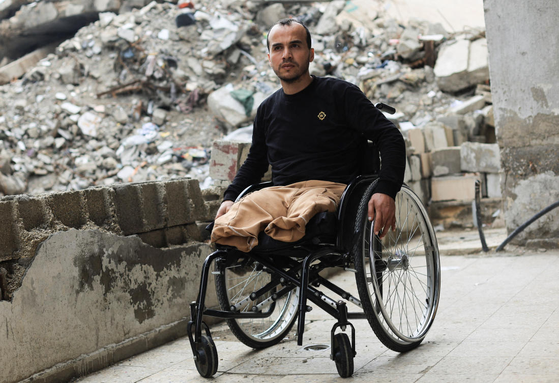Palestinian amputee Omar Abu Ali, 34, who was injured in an Israeli strike, sits in a wheelchair at his home, in Gaza City, April 1, 2026. (REUTERS)