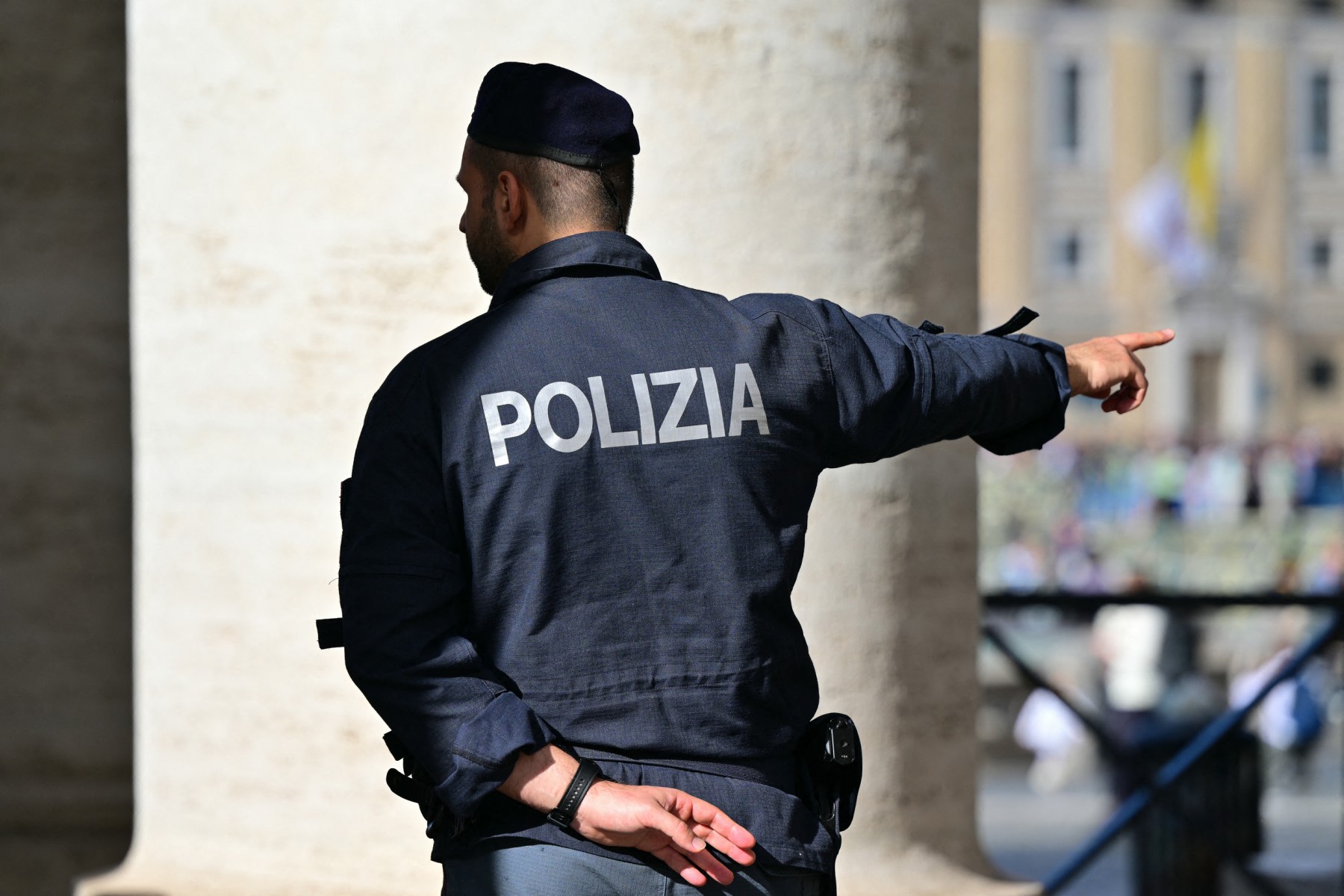 An Italian police officer gestures next to the colonnade of the Vatican. (File / AFP)